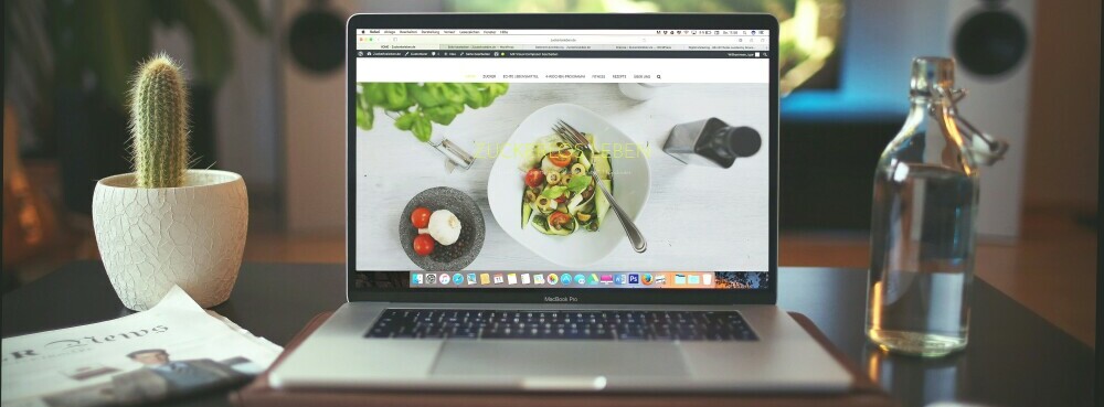 A laptop showing a great looking food website