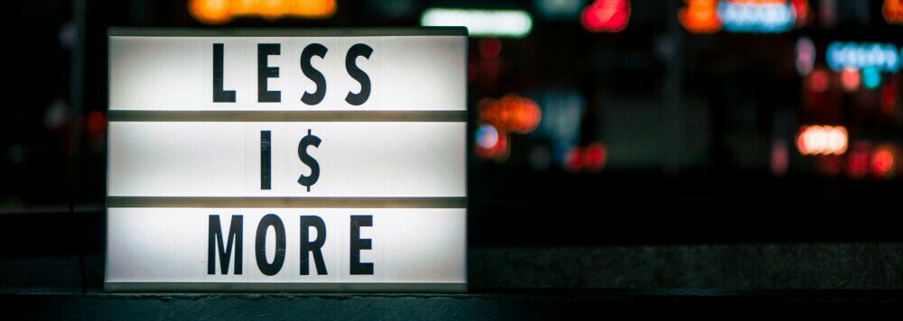 A monochrome sign, black on a white lit background, 