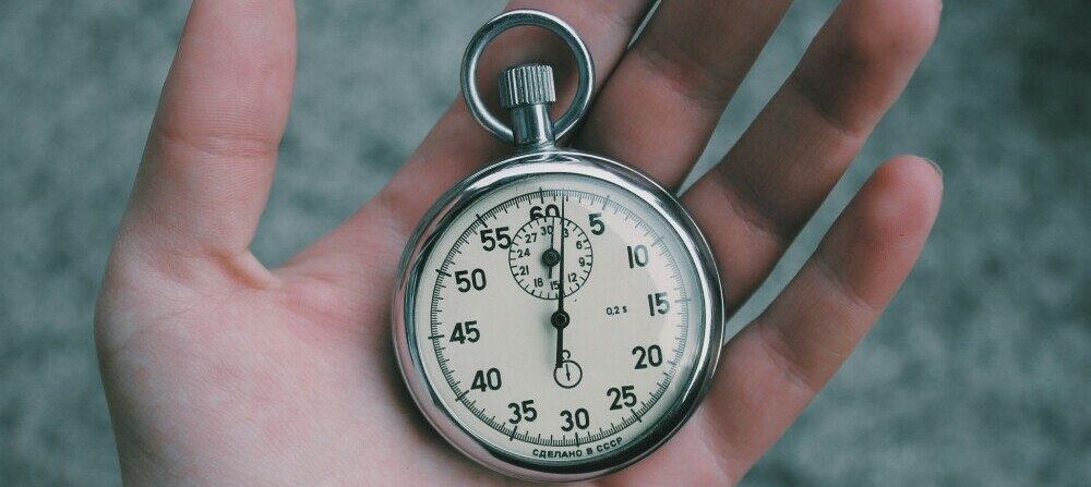 A stopwatch in a person's hand