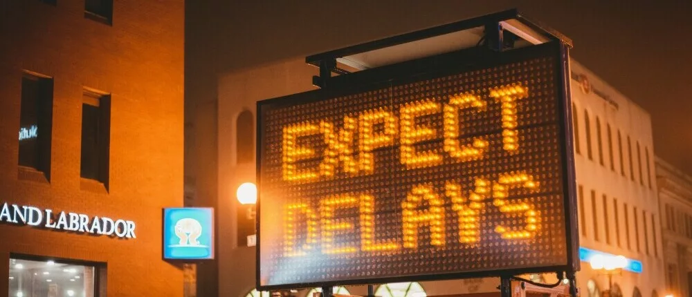 orange matrix sign showing the message, "expect delays"