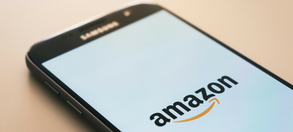 A mobile phone showing the Amazon logo